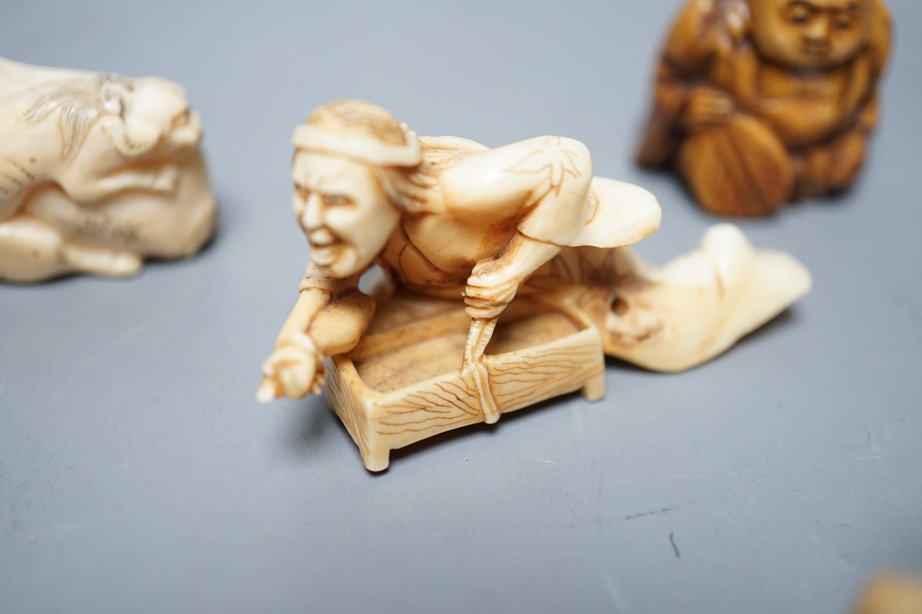 A collection of eight Japanese Ivory and bone Netsuke and okimono, 19th/early 20th century